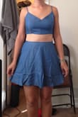 The color is beautiful and it's super cute and comfortable. Medium was the correct size for me. The top fit surprisingly well even though there is no zipper (elastic back). The skirt sat higher on my waist than I expected, maybe because of my pear shape (big hips). Overall, it wasn't as flattering on me in the stomach and legs as I expected. Great for mixing and matching tops and bottoms, but I decided I wouldn't end up wearing it much and it wasn't worth the price tag. - Elise F.
