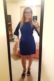This dress is pretty amazing! I'm usually between a small and medium. I went with the medium after I read reviews. I'm glad I went with this size. The color is beautiful. The material is thick. Has very little stretch but not a lot. The tie is nice as it could be tied in front or in back. I'm happy with this purchase. - Jennifer D.