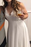This was perfect for my courthouse wedding! I was able to wear a strapless bra. You could go braless, but I like padding to help add a little. The material is quality. Thick and not see-through. The back straps are SO PRETTY TOO. Excellent quality for a great price. If you're shorter, you may need to hem this.I'd guess that unless you're 5'10 this may drag without altering. I got many compliments, and for me the best part is the lace front. The scalloped lace looks so feminine in my photos. Thanks, Lulus! - Linette K.