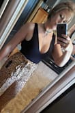 Very soft material and the cut is super cute. It adds a touch of sexy to any outfit without over doing it. I have a longer torso so it is slightly snug and pulls a bit but nothing that would trigger me to return for another size. - Sacha C.