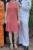 This material is soft, but not see through. It's a true dusty rose color, and has so much flirty flow through the bottom. I love the backless aspect as well. It fits me perfectly, I also let my 5ft, 98lb sister in law (photo) borrow it and it looked fabulous on her as well. Perfect amount of stretch in the material. I love this dress - Sarah A.