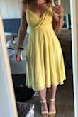 I thought the color and material of this dress was super dreamy. Unlike other reviewers, I thought the top fit really elegantly even without a bra (major plus in my book). However, definitely gaped wide open when I bent over. 100% need fashion tape. Overall I think the midi length just isn't a great look for mem I thought it over-accentuated my wiiide hips. - Jessica G.
