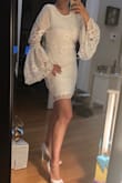 Definitely a show stopper. Sleeves hit a little longer than wrist. Skirt is the perfect length to show a lot of leg. Gorgeous sleeves are really out of the ordinary. I'm normally a size 8 and ordered a large which fit perfectly. Size chart says 8 is a medium and for most Lulu dresses I find that I need a large. - Lisa K.
