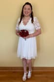 I bought this beautiful dress as a last minute wedding dress, and let me say it was so beautiful. The fabric and detailing was absolutely amazing. I got a lot of compliments and can wear it to other occasions. I got a size medium and it fit perfectly. - Alma V.