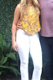 This shirt is a staple! The design and cut of the shirt is beautiful and can be worn for so many versatile occasions. It's comfortable and I have gotten a TON of compliments on it. Just make sure you keep track of the yellow strings that tie up the sides! - Taylor H.