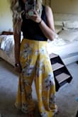 I bought this solely for the bottoms, the top is not very flattering and the shade of yellow is different than the bottoms. (I donated the top.)
The pants are really long on me, even with wedges on but I still love them! The waist is a little loose but I didn't size down because then it would be too tight.
I wore it with a black crop top. Got a lot of compliments on this! - Tram T.