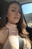 I love a high neckline. Looks really classy and back is out in the back. I'm a 32C and it fits perfectly, but if you have a larger chest I would size up. Love the button closure so you don't have to pull it over your head. I would absolutely recommend this top. Material is thick and not see through. - Trisha O.