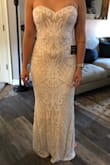 I ordered this dress thinking I could spend a little to add a slit and adjust it so it would be perfect for my wedding. It fit really well and the only reason I'm giving it three stars, areas where the sequins were- already had pieces missing and sequins coming off. This is sadly not worth $250 for the material. - Hannah D.