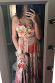 Beautiful dress! The material is amazing and extremely comfortable. However, I did have to hem it because it was much longer than I preferred with heels. It also has a very low V cut, which I am not the biggest fan of. Seems to be made to fit a tall lady with no chest. The sides of the chest do gap a bit which is frustrating (added a picture of it). However, a seamstress could probably fix this, too. The strap around the waist is a bit questionable, too, since it seems to awkwardly wrap above the back of the dress. I would recommend this dress to someone with a smaller chest and who has no problem taking it to the seamstress! - Katie H.