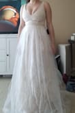 Its a nice dress. Nice beaded belt, many layers. Personally I'm not a fan of the top layer. I think the layer below is prettier. I am wearing in XS in the photo, which is 2-3 sizes too small. - Alexandra D.