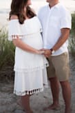 I bought this dress, along with 3 other outfits, for a Gender Reveal on the beach. It was a Final Sale Item so I hesitated to buy it but decided to take the risk because it was only $19. It was a little tight around the bust but with some help from my husband I was able to zip it up and it was so comfortable and just an all around beautiful dress. I was very pleased with the quality of the material and the details on the dress. I would highly recommend it. I typically wear a size 6 or 8 but because I am pregnant I wasn't sure if I should size up because I was in between sizes. I'm glad I went with the Medium and squeezed in. I think the Large would have been too big. - Maria L.