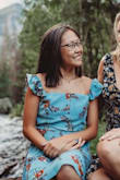 Just a cute colorful summer dress. My younger sister borrowed it so it was a little big on her but fit me true to size. She wore it with the sleeves up since she is younger. Looks great in photos and flatters everyone. - Bethany S.