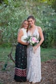 As a very practical bride, I wanted a dress that was elegant, flattering, and one that I could re-wear again - the idea of buying a dress to only wear once is too wasteful for my taste. This dress fit beautifully and all I had to do was get it hemmed, because I wore flats with them. - Priscilla C.