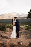 This dress was my dream dress, lace sleeves, open back, just perfection and less than $100. I loved everything about this dress and it was perfect for my Colorado elopement. It did have a little stretch to it but if you have a bigger booty, be prepared to wiggle into it. 
I did have it altered and that helped with the fabric underneath being longer than the lace. I also added a belt from David's bridal and I love that I did that.
The model photos definitely do not do this dress justice and I would highly recommend this dress for elopements or traditional weddings. - Roxana M.