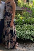 I LOVED wearing this dress to an indoor/outdoor summer wedding. It was SO beautiful and comfortable. I felt amazing in it and received so many compliments that night. I ordered a medium and did have to wear a wedge- the dress was too long for flats. The back was adjustable to it can be tightened or loosened to your own comfort. Overall this dress was amazing, I would highly recommend. - Anna F.