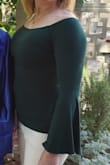 Only wore once at this time....it's thin enough so I can comfortably wear in our warm weather. The off the shoulder mechanisms really are secure and I didn't have to fuss with positioning. I am nervous about the material seeming to ball with wear/washings. Too early to confirm that though. - Dani G.