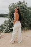 I'm obsessed. They are wide legged and a little bit long and may have to be tailored and tapered. I'm 5-3 and 124lbs. I got the XS and it fit perfect. - Christie M.