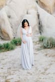 I wore this dress for my maternity photo shoot (at 6 months). I like the quality of the fabric because it is a bit on the heavier side and there as there are several layers. The color is a very light, muted grey, which was exactly what I was expecting. The bust area was a bit tight by the time I wore it, but I think it would be a perfect fit if I wasn't pregnant. The length was a bit long for me, and normally I would alter it, but I let it touch the ground for the photo shoot. Overall, I am very happy with this dress and I am definitely hoping to wear it again when I'm not pregnant! - Ketti W.