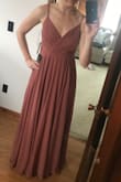 Using it as a bridesmaid dress. The inside lining is a comfortable silk all the way through. Heavier than some of the other dresses I tried but the weights adds the the quality feel of it. Great coverage on the chest. I actually did size down to a small in this. - Cassidy S.