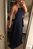 Love the dress. It's comfortable and good material. I had to tighten the straps quite a bit so I would get a lot of side boob but other than that it's a great dress! No bra is needed and I will be getting it hemmed because it is very long. Wearing it as a bridesmaid dress - Cara H.