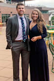 Wore this to a wedding over the weekend and it worked out perfectly. The V is deep enough that it showed some chest, but not deep enough that I couldn't wear a bra underneath.

The slit stays closed mainly, even when dancing, but it's easy to pop a leg out for pictures. - Talen M.