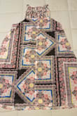 I'm usually a small in Lulus, but an XS was plenty large on me. The length and width were okay (a tad short and wide), but I really don't like the black multi print. The colors look cheap, but what really bothered me was that the garment's construction looks really lazy. The pattern on the front looks okay, but the pattern is sewed right down the back of the dress, which makes it looks very asymmetrical. The position of the pattern is also unique to the dress. My dress does not look like the back of the one the model is wearing in the photo. I'll be returning this one. - Elizabeth L.
