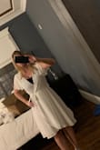 This dress is very wearable for everyday and has a nice flowy fabric. But only with something underneath. I put a sports bra under mine in the picture to solve the problem. Without it the dress is just too revealing. - Jodell N.