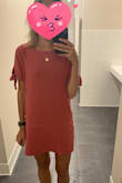 Ordered this dress in both a small (my usual size) and a medium as other reviewers had commented on length. It's a little baggier than I would normally prefer but being 5'8" I definitely needed the medium for length and wish it was even just a half inch longer. The fabric does wrinkle quite a bit in back and some in the front when seated but the dress is very comfortable and easy to wear - Amy V.