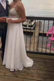I bought a wedding dress from a bridal store, had it altered and experienced major dress regret as I did not love it anymore. One week before my wedding day, I received an email from Lulus that this item was back in stock. I felt "what do I have to lose?" and rushed the dress in. When it arrived, I tried it on and it fit perfectly (no alternations were needed). I knew it was meant to be!
I received so many compliments and the dress held up well (minus a few rhinestones falling off) after several hours of dancing.
Absolutely get the dress!! - Madelyn H.