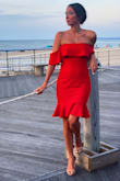 Buy this dress! Fits amazing! I received so many compliments. I wore this to a beach wedding on one of the hottest days of summer. Dress is a thicker stretchy material. Probably not best for a hot day but I didn't care! - Katina M.