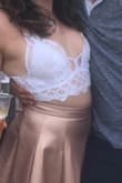 I was nervous about wearing a top like this because I am definitely not a tiny girl like the model, but I needed something I could wear on a super hot day at a festival. I was actually pleasantly surprised by this top paired with a high waisted skirt. It's super comfy and I didn't wear a bra and you couldn't tell at all. - Staci S.