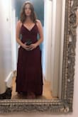 This dress is very beautiful, the material is fairly heavy so it hangs nicely. The wrap style is very flattering and the lace up back is pretty. I found it fit just right, I wouldn't have wanted a smaller size for the small zipper portion at the back to do up properly. - Paige B.