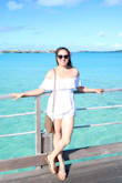 It was a little loose, but the romper holds securely on the shoulders.  It's a little sheer so don't wear bright underwear! I plan to use it on our vacation next week to Tahiti and Bora Bora and I think it will also be a nice swimsuit cover. Note: don't judge it by how it comes out of the package, give it a good steaming to see how pretty it is. - Holly H.