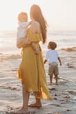 This dress got so many compliments. It's flowy and light. It's very flattering and effortlessly stunning. It's a textured satin kind of fabric so there's a bit of shine but a ton of movement because it's lightweight. I loved it. It was perfect. - Eden B.