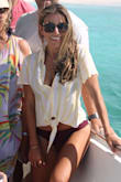 Love this top for a beach getaway! I've worn it out with shorts or as a cover up over a swim suit. The color's great and fit is good (blousy, not fitted). Be careful with washing it though! As with many Lulus items it shrinks. I washed it in cold water and line dried it and it still shrunk up a bit. I'd say size up if you're between sizes! :) - Shannon K.