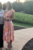 Loved this wrap dress! Got a ton of compliments on the vibrant color and flowy bottom. It is a little low cut but I did not have any issues (you don't feel like you're falling out of it) but for those who are smaller chested I would recommend going down a size! I am usually a size L but went for a medium and it fit great - Anna B.