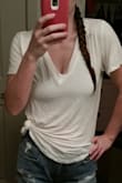 I wanted a basic white tee as the picture shows. Perfect with jean shorts. I wore it previously, so it is wrinkled but came fine.  I ordered a small and its big on me like the model but that was the point. so if you want a small tight white shirt, this probably isn't,  
Love it though. - Katrina W.