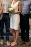I bought this dress for my last minute courthouse wedding and what can I say - it was absolutely perfect! It was just enough skin for me to handle the Florida heat without being too naked. I wore the dress with an adhesive bra since the low cut in the back would have shown the bra strap. I read it other reviews that it was tight so I was a bit nervous about it since I had to sit in it for a few hours but it was perfect for my body. I absolutely loved the dress and I would order it again for the occasion! 

+ I haver never ordered from Lulus before and was absolutely amazed how easy the shipping was! I ordered two dresses and both arrived two days earlier than expected - win win for a last minute bride like me. :) - Maximiliane T.