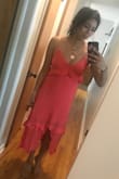 I just received this dress and I had to write a review right away to tell everyone to buy it! Don't even think about it just do it! The coral color is so beautiful and the fit is so flattering! It's a little loose but I like that! It's so fun and flirty! I love it! - Samantha I.
