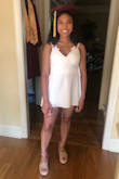 Bought this for my high school graduation and it was perfect! The only thing I would say be careful of is how short it is, I had to iron mine and stretch it out so that it would be long enough (I also have long legs and a short torso) but that's the only con about it. Other than that it's great! - Trinity P.