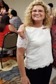 I love this lace top because it is not tight fitting, so you can move easily. The look is true to the picture shown. It is a shirt that you would not tuck in. Looks great with pants or skirt. This is at my High School Reunion. - Debborah P.