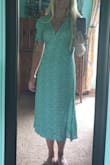 This dress was very flattering the color and pattern were very pretty. Adjusting waist was easy with wrap style. Measurements are exactly as described with model fit. Glad I made this purchase :) !!! - Amanda V.