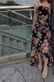 Dress felt like a showstopper - the flower print is gorgeous. Top fit is more conforming, the bottom is a great twirler. The one exception is that I am short and so the dress is a bit long. If I had worn taller heels, would not have been a problem, but I keep to short heels typically.

The asymmetrical cut can be adjusted with the straps - so if you want more drastic or more subtle, you can change that. - Martha K.