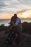 I wore this dress to a beach wedding in Hawaii and it was perfect. Super light and comfortable, even in heat and humidity. It definitely runs a little long (I'm tall and the back dragged a little without heels) and I used double sided tape to make the neckline less revealing so I could wear a bra with it. I also used double sided tape to close up the front around my upper leg, as it was a windy day and I didn't want to flash anyone! The back is high enough to hide a bra and the adjustable ties make it super forgiving. I couldn't be happier with this dress and highly recommend it. I styled it with tan wedges and a straw circle bag, but it could definitely be dressed up as well. - Kristen M.