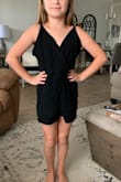 Ok so I adored this romper and the fit when I received it!! I'm 5'2" and about 110lbs, typically wear a XS or Small at Lulus. A few reviews said it was a little small so I ordered the Small. Well it accidentally got dried in the dryer and things went horribly wrong It shrunk up to hardly nothing! Posting a pic of it on my 55lb 10 year old sister for reference lol So again it's a great romper but I would definitely either size way up or strictly spot clean. ABSOLUTELY NO DRYER - Karlie N.