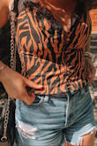 I got a medium and the shirt fits me, the only thing is my chest area is a little larger so the buttons at the top are more spread apart but I don't mind because it's a cute shirt and I got a ton of compliments! - Moriah T.