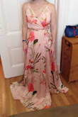 This dress is huge. I guess petite women are not Lulus target market. The top is for someone with a much longer torso. To avoid a baggy belly, the straps begin way up near my shoulder blades and cut under my armpits. Not to mention that I had to hem it by at least a foot; that is to be expected. The slit sits chastely below my knee. The dress is also poorly sewn without lining up the pattern at the seams. Obsessed (the description for 5 stars) is a good description of how I feel about this dress, but not in a particularly good way. - Emma R.