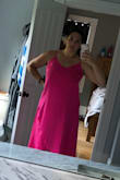 This dress fits so nicely! It's super flattering. Runs a bit big but I wouldn't change the size because I'm fairly large chested. I ordered a Large & it's roomy in the body but overall, I love this dress! The color is super bright in person. I've gotten lots of compliments on this dress already and it's not even 9am yet! - Nannette H.