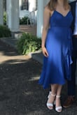 Wore this to a friend's wedding this summer and it was perfect for the occasion. It can definitely be dressed up or down depending on what accessories you pair with it. The fit is good although where the waistline was supposed to hit on me was actually around my ribs, about 2 in too high. I did loosen the straps which helps some but still a little high. Overall, very easy to get into but you do have to physically wrap the dress around yourself. The fabric is nice and feels like good quality! - Katie F.