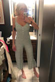 This is one of the most perfect jumpsuits I have ever ordered. It fits perfectly!!! I was hesitant if I should get a small or medium and ended up going with the small. Which I am so glad I did! Medium would have been way too loose. The color is such a beautiful green and the material is lighter which is perfect for summer. I've worn this three times now and receive more compliments on it then anything else I own. If you're considering it BUY IT!! - Jakii S.